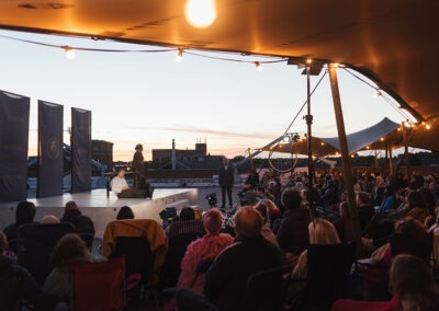 A wide angle shot of the audience watching the performers