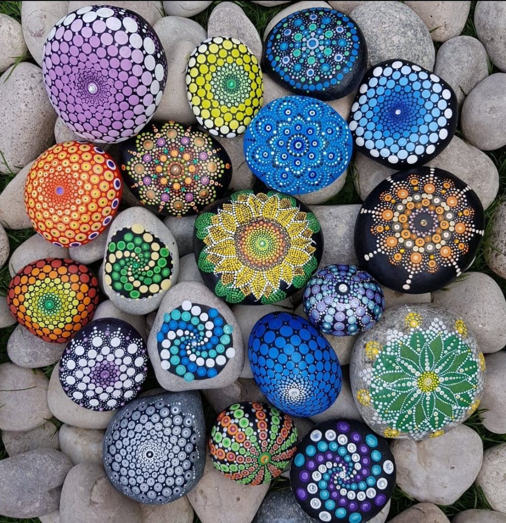 Pebbles painting with colourful mandala patterns